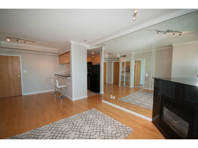 Spacious penthouse living room with hardwood floors and modern furnishings. - 3405-1111 W Pender, Vancouver Downtown