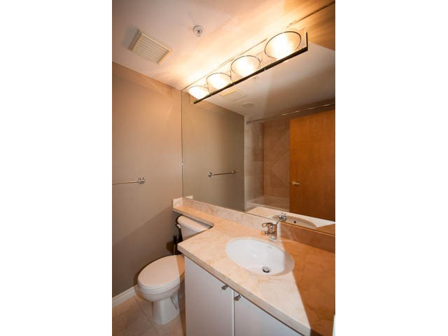 Bathroom with marble countertop and modern lighting fixtures. - 3405-1111 W Pender, Vancouver Downtown