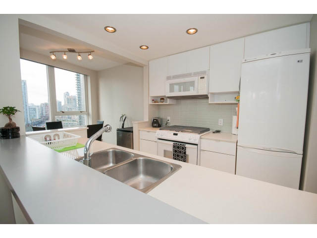 Bright kitchen with white countertops and city view. - 1702 - 928 Beatty Street, Vancouver Downtown