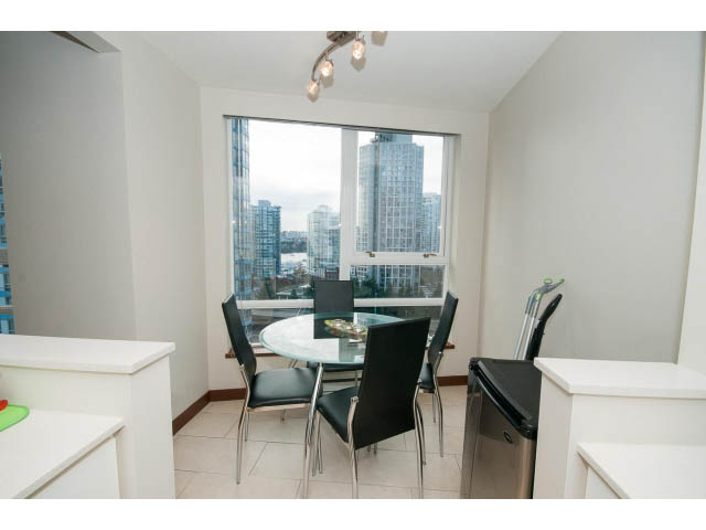 Bright dining area with city view and modern furnishings. - 1702 - 928 Beatty Street, Vancouver Downtown