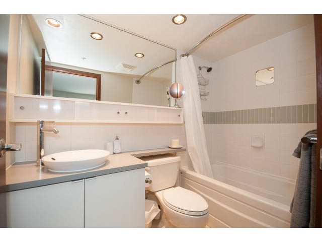 Bright bathroom with modern sink, toilet, and bathtub, clean and minimalistic design. - 1702 - 928 Beatty Street, Vancouver Downtown