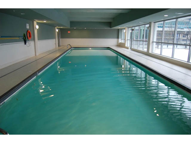 Spacious indoor pool with large windows and city view. - 1702 - 928 Beatty Street, Vancouver Downtown