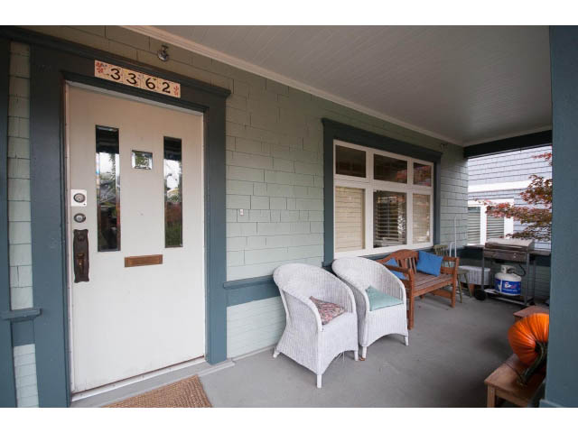Furnished patio with wicker furniture and a pumpkin decoration. - 3362 West 3rd Ave, Vancouver West Side