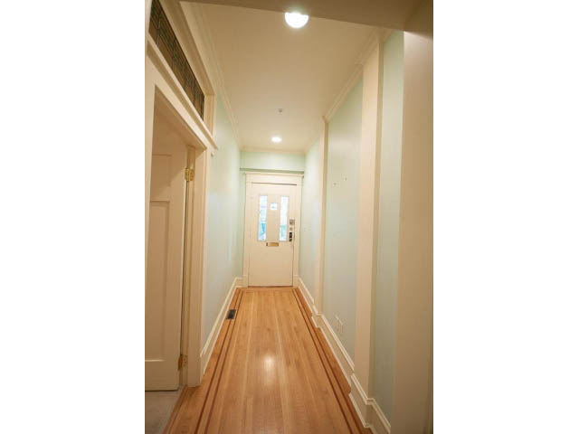 Bright hallway with hardwood floors and light blue walls. - 3362 West 3rd Ave, Vancouver West Side