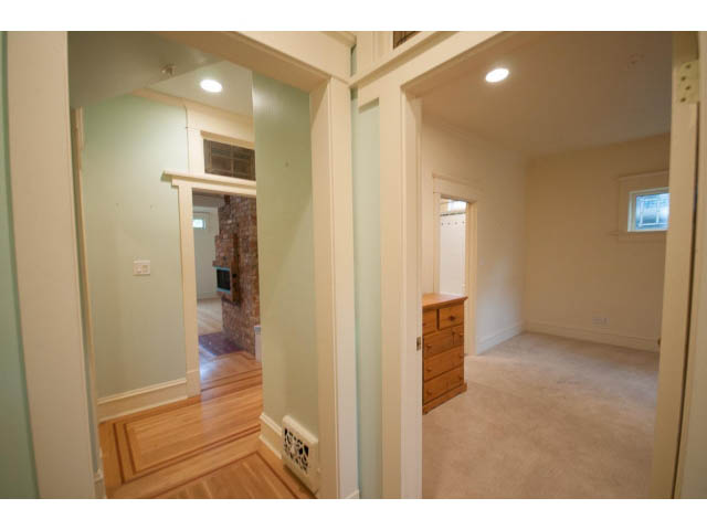 Spacious living room with hardwood floors and neutral walls. - 3362 West 3rd Ave, Vancouver West Side