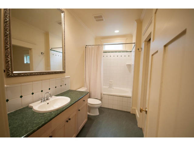 Furnished bathroom with green countertops and white tile walls. - 3362 West 3rd Ave, Vancouver West Side