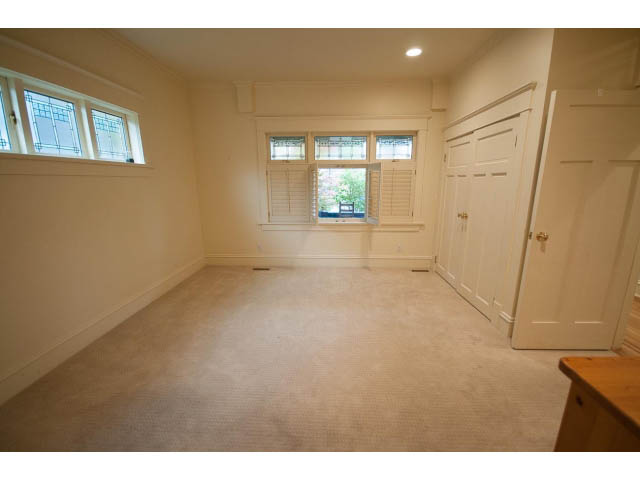 Spacious den with carpeted floor, large windows, and closet. - 3362 West 3rd Ave, Vancouver West Side