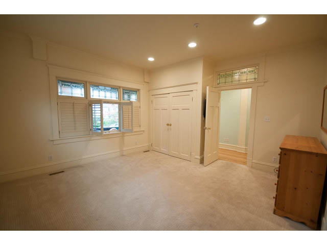 Bright living room with hardwood floors and large windows. - 3362 West 3rd Ave, Vancouver West Side