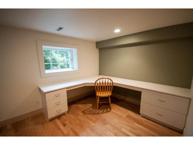 Furnished den with built-in desk, hardwood floors, and a window with a city view. - 3362 West 3rd Ave, Vancouver West Side