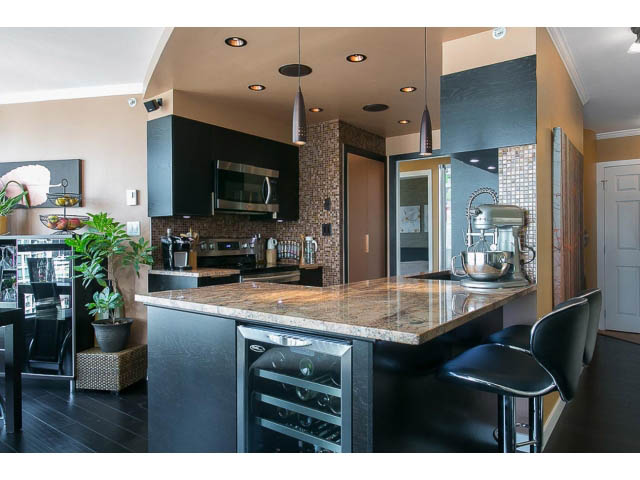 Bright kitchen with granite countertops, hardwood floors, and a wine cooler, showcasing modern design. - 1505 - 488 Helmcken, Vancouver Downtown