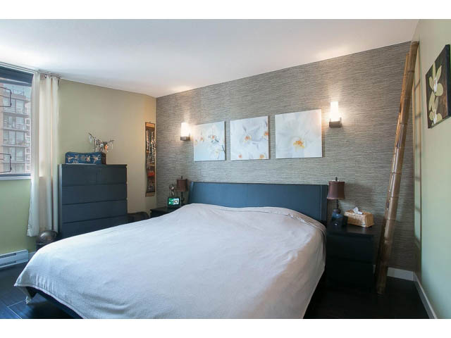 Furnished bedroom with large bed, city view, and modern decor. - 1505 - 488 Helmcken, Vancouver Downtown