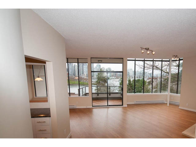 Spacious living room with hardwood floors and city view. - 14 - 1201 Lamey's Mill Rd., Vancouver West Side