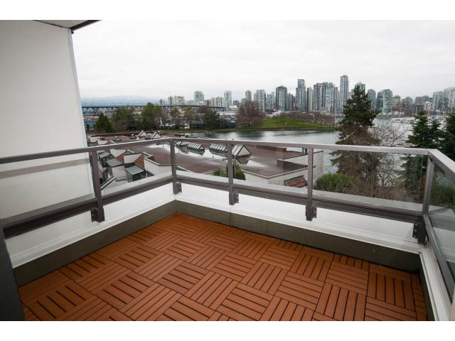 Furnished balcony with wooden flooring and city view. - 14 - 1201 Lamey's Mill Rd., Vancouver West Side