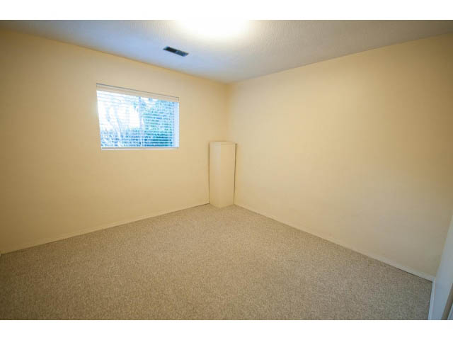 Spacious den with carpeted floor and window view. - 610 Newdale Rd., West Vancouver