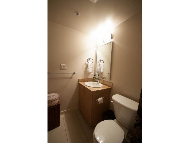Furnished bathroom with wooden vanity and modern lighting. - 404 - 909 Mainland, Vancouver Downtown
