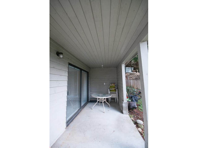 Furnished patio with sliding glass doors and outdoor furniture. - Suite - 1719 Peters Rd, North Vancouver