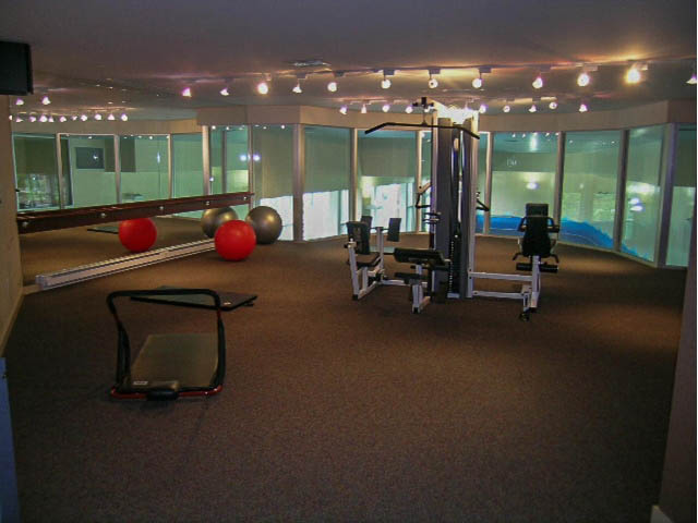 Fitness room with exercise equipment and large windows. - 708 - 193 Aquarius Mews, Vancouver Downtown