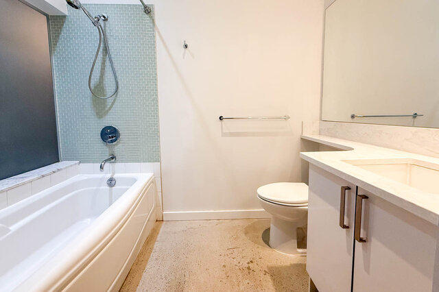 Spacious bathroom with marble countertops and a modern shower setup. - 308 - 546 Beatty Street, Vancouver Downtown