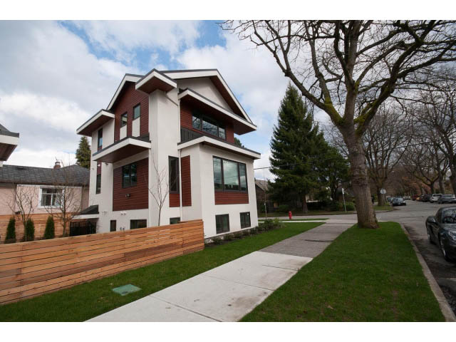 Bright, modern 3-bedroom house with large windows and wooden fencing. - 2895 Balaclava St., Vancouver West Side