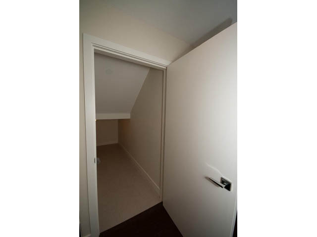 Bright hallway leading to a door, clean and minimalistic. - 2895 Balaclava St., Vancouver West Side