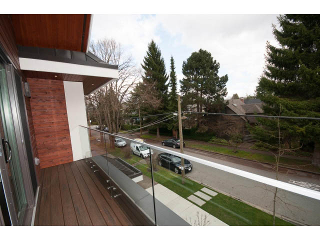 Bright balcony with wooden flooring and city view. - 2895 Balaclava St., Vancouver West Side