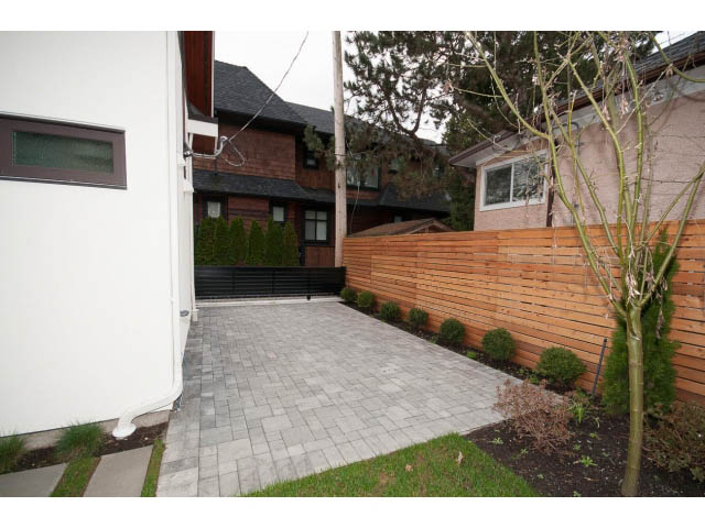 Furnished patio with wooden fencing and stone pavers. - 2895 Balaclava St., Vancouver West Side