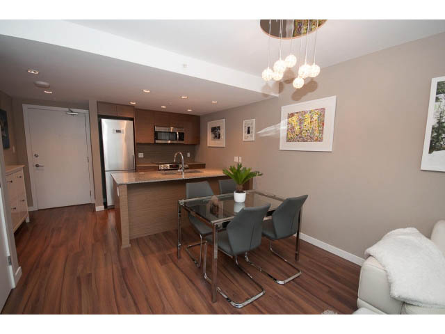 Furnished 1-bedroom condo with hardwood floors and modern kitchen counter. - 1602 - 135 East 17th Street, North Vancouver