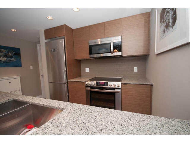 Bright kitchen with granite countertops and stainless steel appliances. - 1602 - 135 East 17th Street, North Vancouver