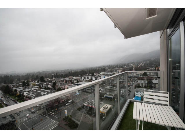 Furnished balcony with city view and glass railings. - 1602 - 135 East 17th Street, North Vancouver