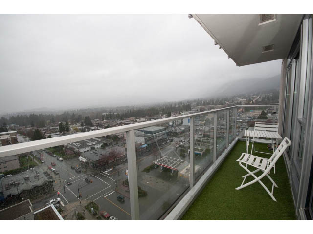 Furnished balcony with city view and greenery. - 1602 - 135 East 17th Street, North Vancouver