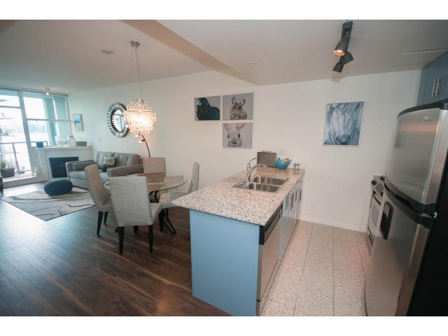 Furnished 1-bedroom + den with hardwood floors, city view, and modern decor. - 906 - 168 Esplanade, North Vancouver