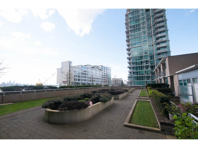 Bright living room with city view and modern furnishings. - 906 - 168 Esplanade, North Vancouver