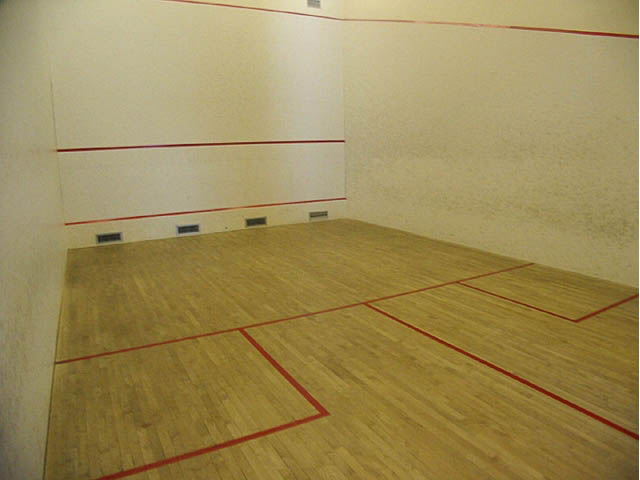 Bright squash court with wooden floor and red boundary lines. - 1502 - 907 Beach Ave, Vancouver Downtown