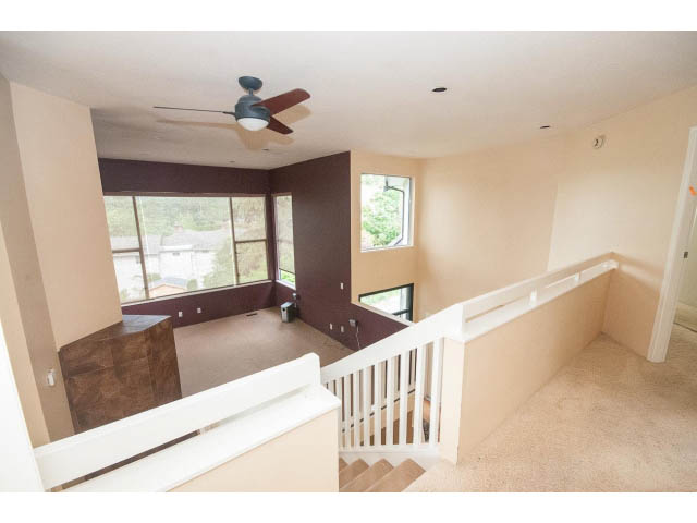 Bright living room with hardwood floors and city view. - 3890 Sharon Drive, West Vancouver