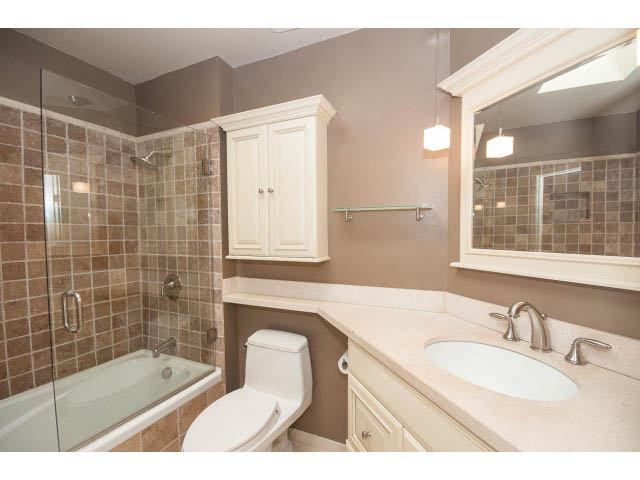 Spacious bathroom with beige countertops and a walk-in shower. - 3890 Sharon Drive, West Vancouver