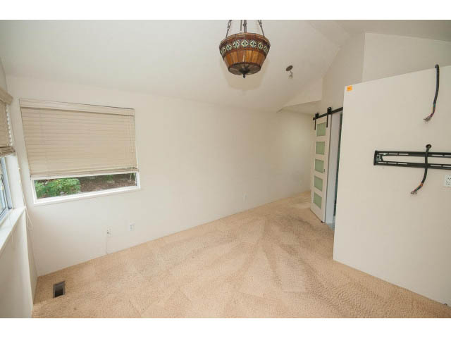 Bright living room with parquet flooring and a large window. - 3890 Sharon Drive, West Vancouver