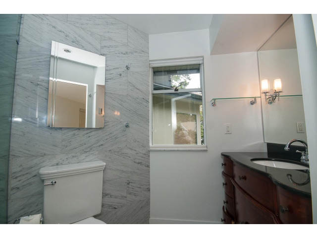 Bathroom with marble countertops and a window view. - 3890 Sharon Drive, West Vancouver