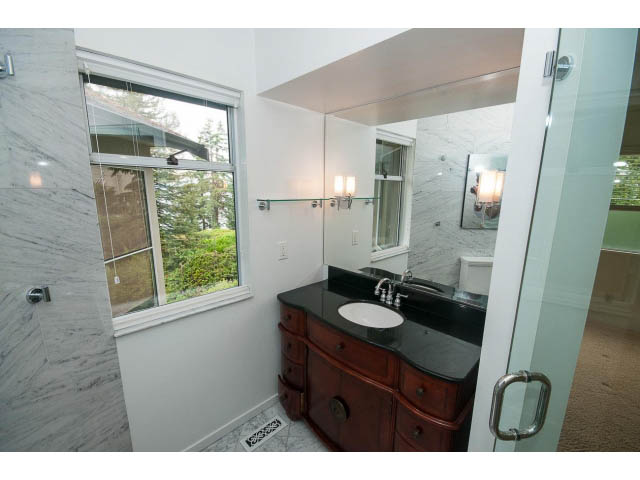 Spacious bathroom with marble countertops and a city view. - 3890 Sharon Drive, West Vancouver