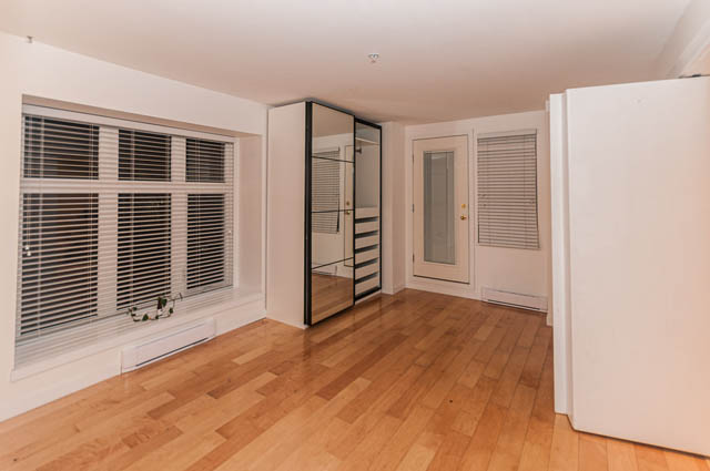 Bright living room with hardwood floors and large windows. - 2263 Heather st., Vancouver West Side