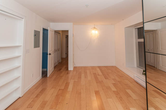 Furnished living room with hardwood floors and a chandelier. - 2263 Heather st., Vancouver West Side