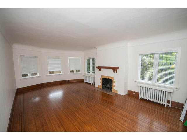 Spacious living room with hardwood floors and large windows. - 5756 Angus Drive, Vancouver West Side