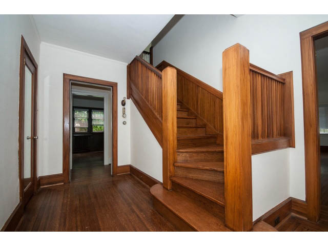 Bright entryway with wooden staircase and hardwood floors. - 5756 Angus Drive, Vancouver West Side