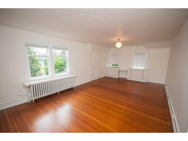 Bright bedroom with hardwood floors and white furniture. - 5756 Angus Drive, Vancouver West Side
