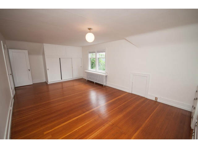 Bright living room with hardwood floors and white walls. - 5756 Angus Drive, Vancouver West Side