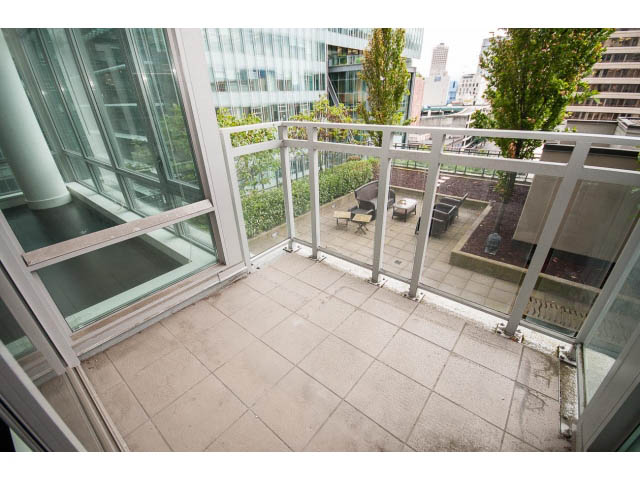 Furnished balcony with city view and modern furnishings. - 1106 - 788 Richards, Vancouver Downtown