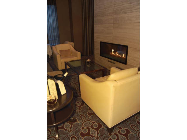 Furnished living room with modern fireplace and comfortable seating. - 1106 - 788 Richards, Vancouver Downtown