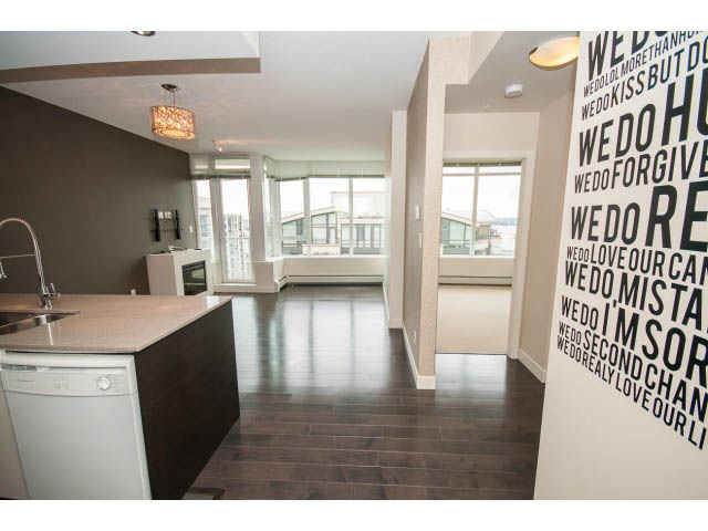 Bright kitchen with modern island, hardwood floors, and city view. - 1105 - 175 West 2nd Street, North Vancouver