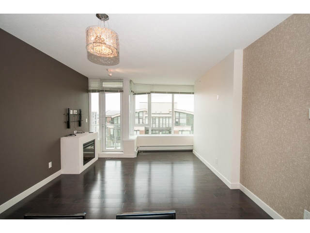 Bright living room with hardwood floors and city view. - 1105 - 175 West 2nd Street, North Vancouver