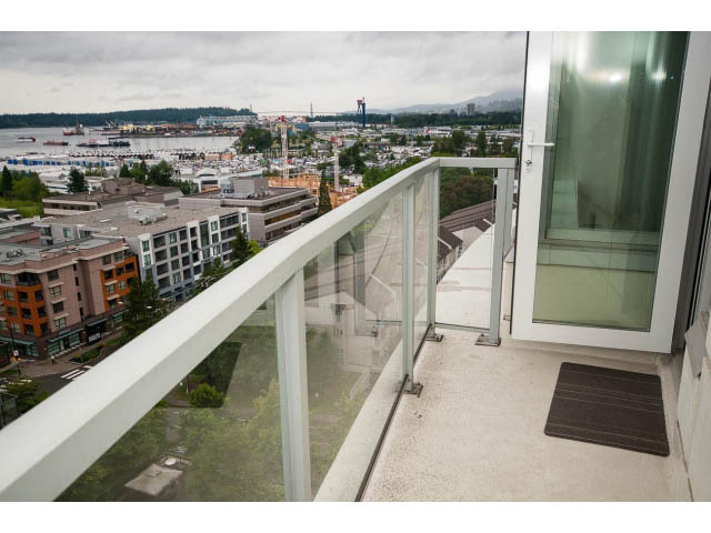 Balcony with glass railings and city view. - 1105 - 175 West 2nd Street, North Vancouver