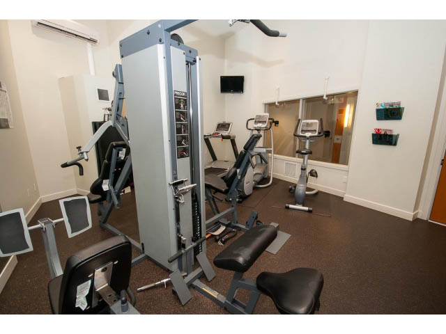 Fitness room with cardio machines and weight equipment. - 1105 - 175 West 2nd Street, North Vancouver